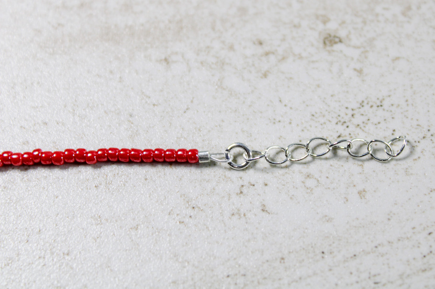 Close-up of the 1-inch extender chain, demonstrating the bracelet's adjustable sizing feature.