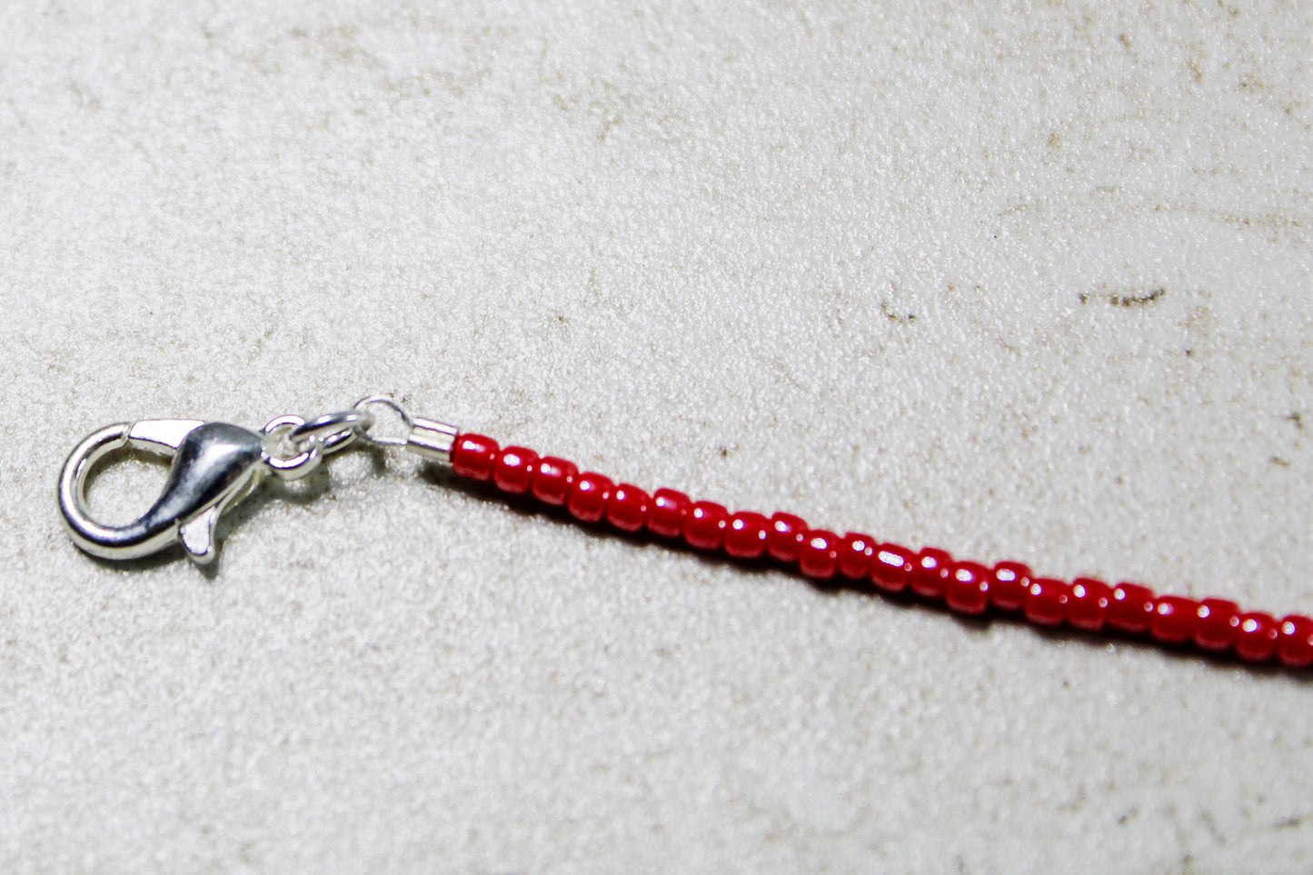 Detailed image of the lobster clasp, emphasizing the secure closure mechanism.