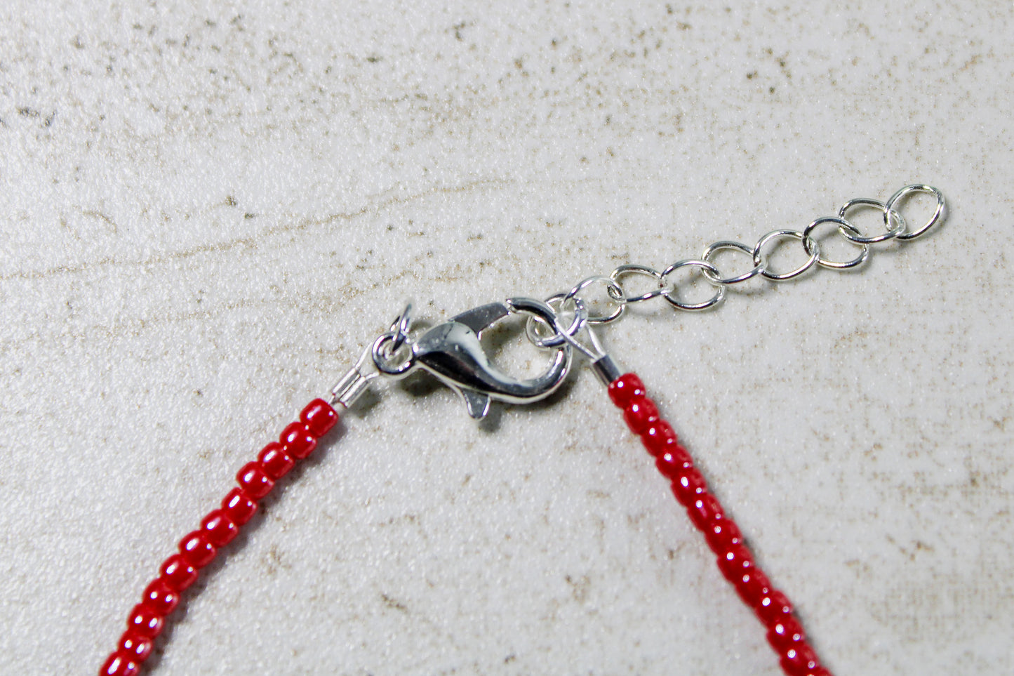 Image showcasing both the lobster clasp and extender chain, illustrating the bracelet's adjustable fit and ease of wear.