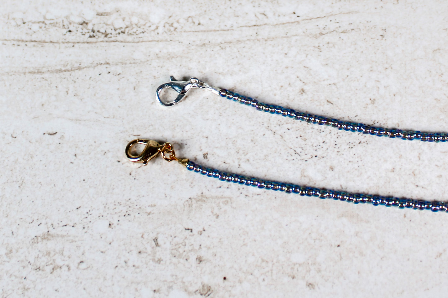 Detailed view of the lobster clasp on the September bracelet in gold or silver, with smooth hardware finish.