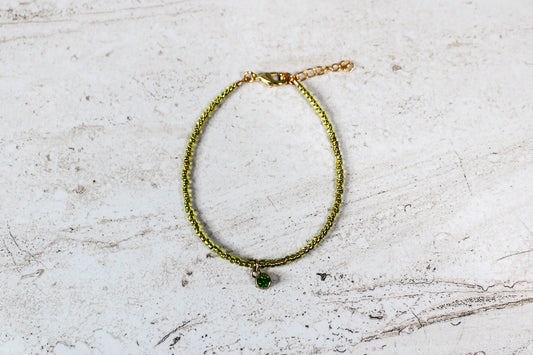 Peridot-inspired August bracelet featuring cheerful green beads and a polished gold lobster clasp with extender.