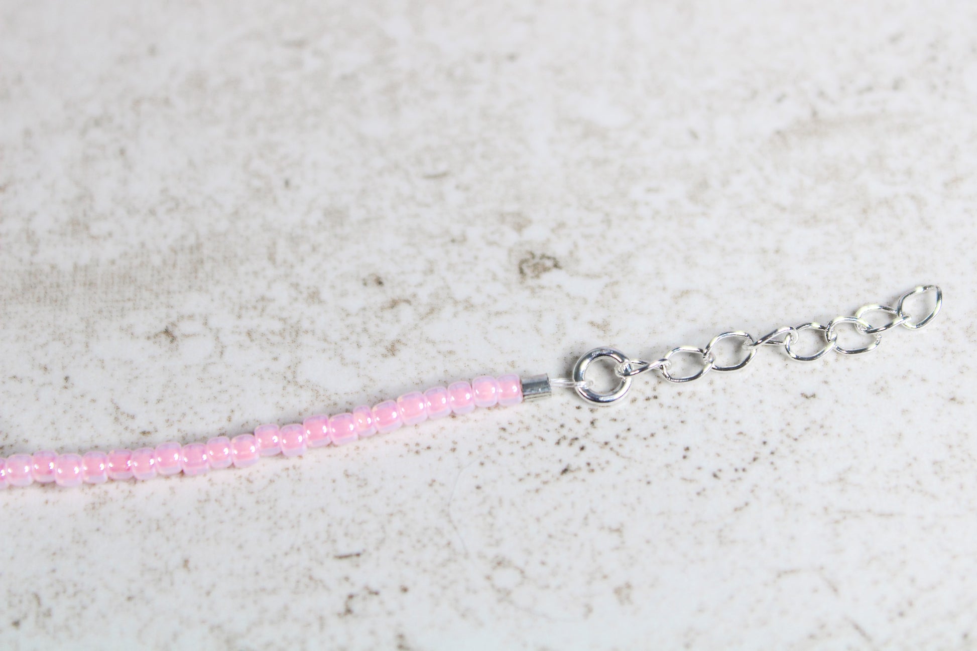 Close-up of the silver extender chain showing adjustable sizing on the Short n Sweet bracelet

